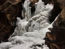 Boulder falls frozen